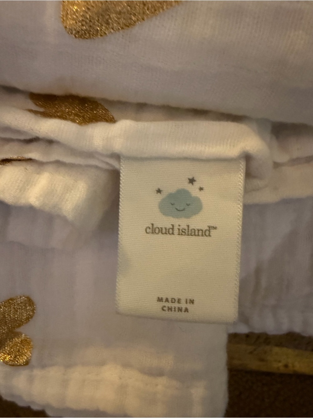 Cloud Island White and Gold Muslin Baby Blanket